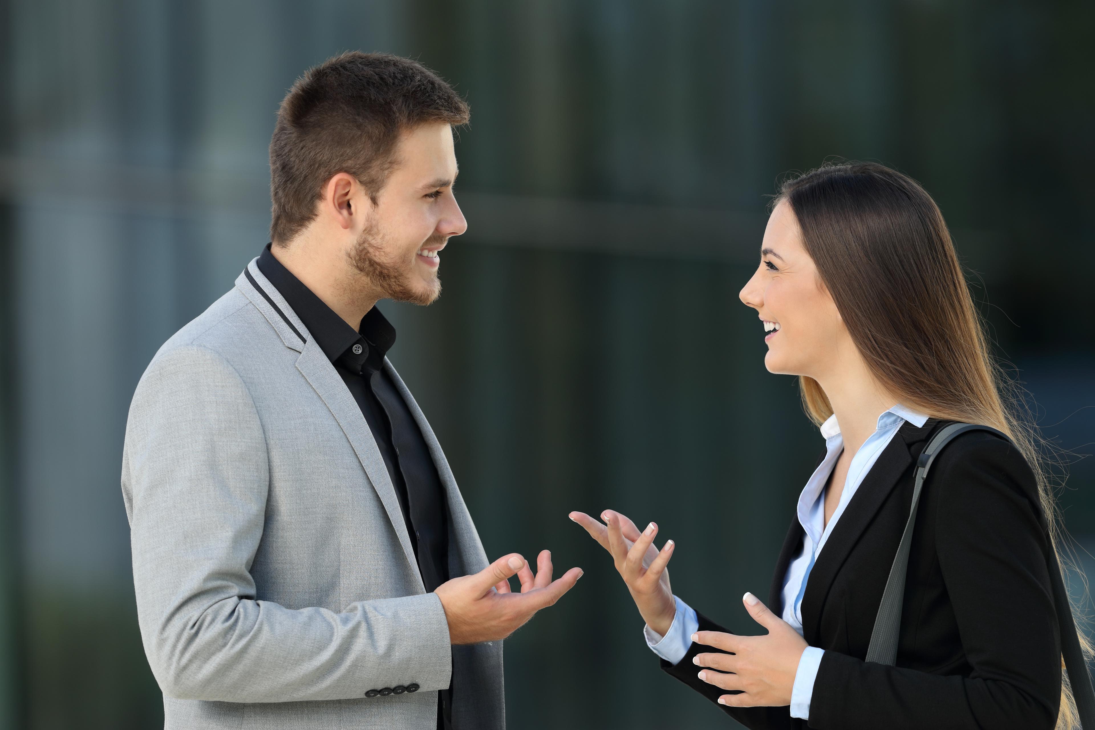 two persons talking